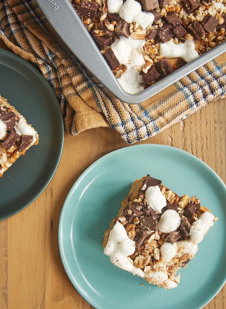 overhead view of slices of Peanut Butter Rocky Road Bars and a pan of remaining bars