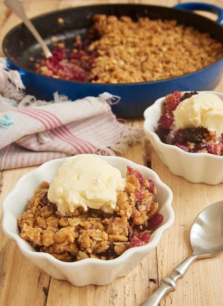 servings of Skillet Berry Crumble topped with ice cream