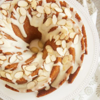 Amaretto Almond Bundt Cake topped with an almond glaze and sliced almonds