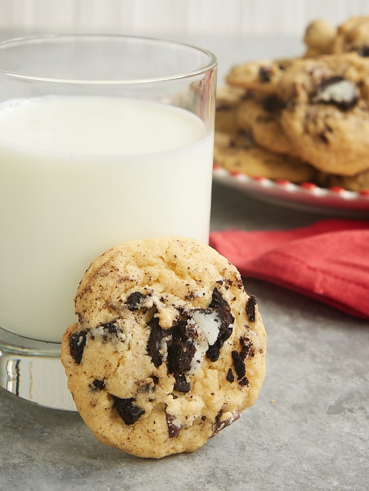 a Cookies and Cream Chocolate Chip Cookie and a glass of milk