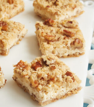 Pecan Cheesecake Bars served on a white plate