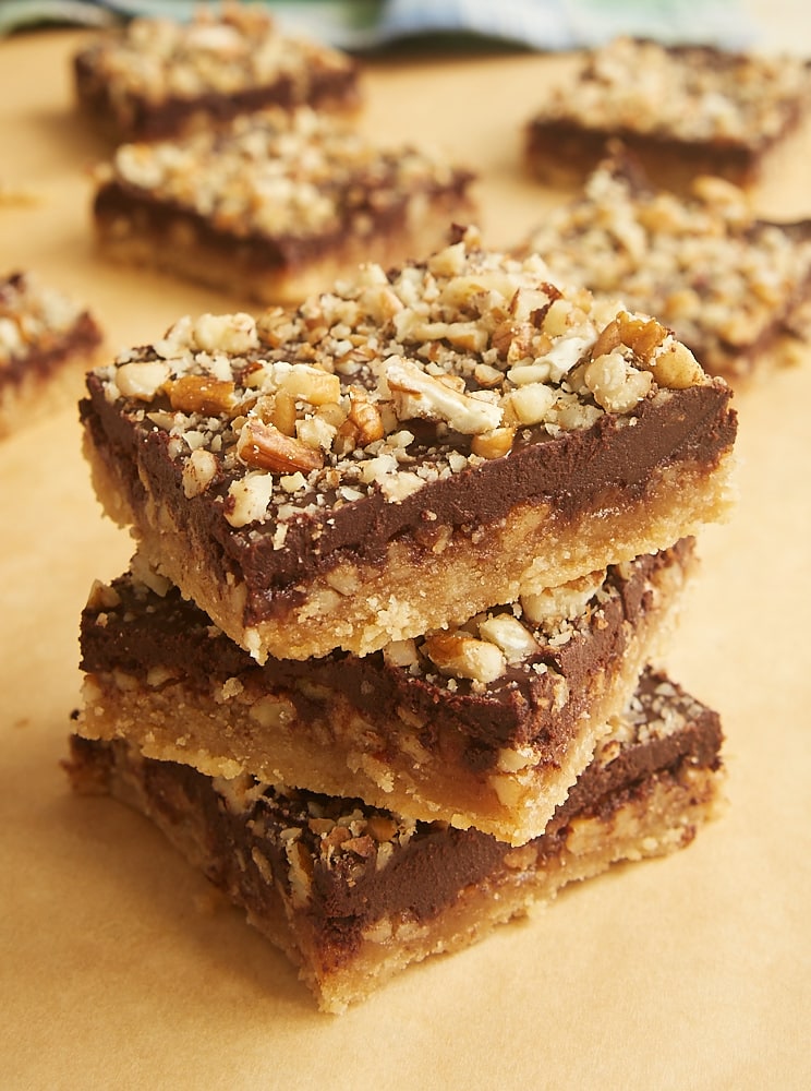 stack of Butter Pecan Turtle Bars on parchment paper