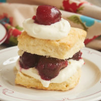 Sweet cherries, fluffy biscuits, and whipped cream combine for these delightful Cherry Shortcakes with Cream Cheese Biscuits. A summertime must! - Bake or Break