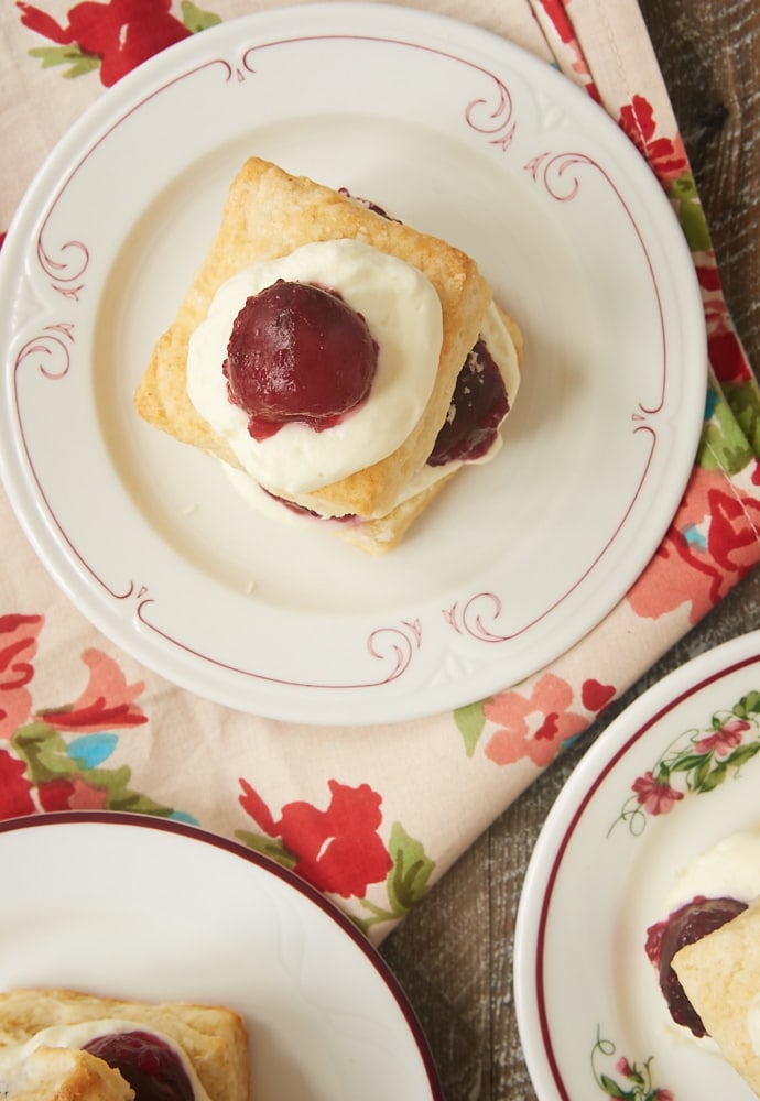 Sweet cherries, fluffy biscuits, and whipped cream combine for these delightful Cherry Shortcakes with Cream Cheese Biscuits. A summertime must! - Bake or Break