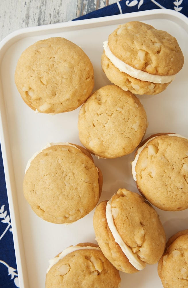 white tray filled with White Chocolate Macadamia Sandwich Cookies