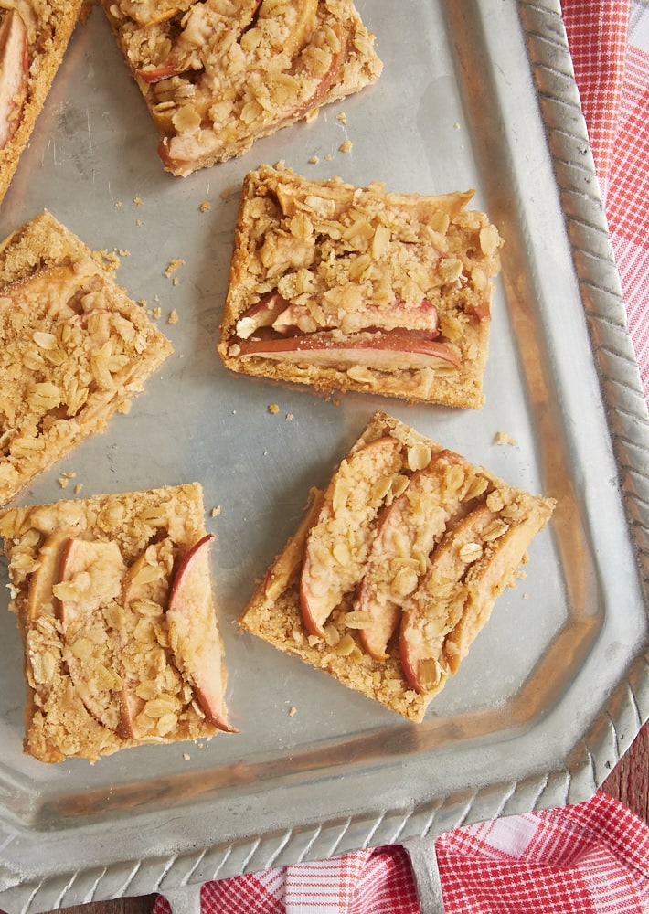 overhead view of Apple Cinnamon Crumb Bars served on a pewter tray