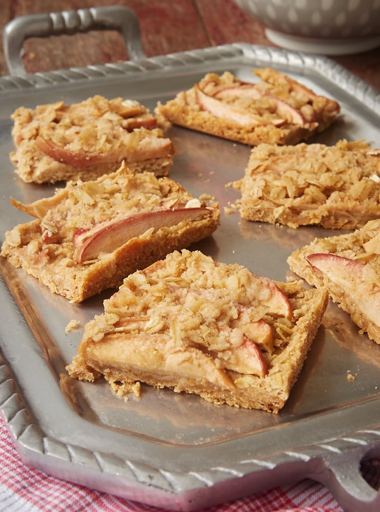 Apple Cinnamon Crumb Bars on a pewter tray