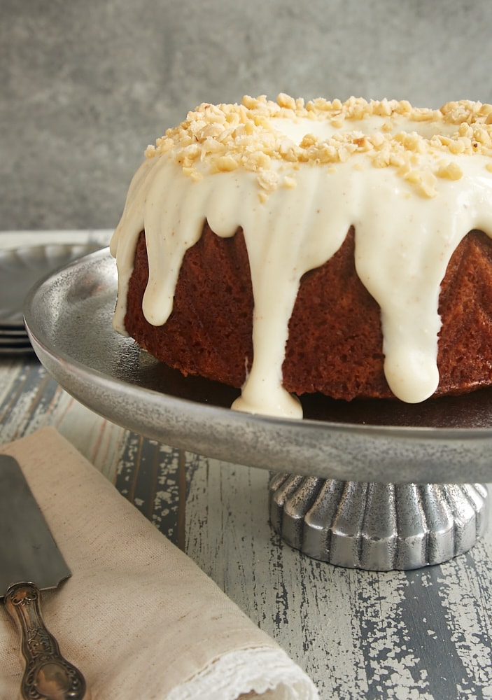 Cinnamon Hazelnut Bundt Cake with Brown Butter Glaze on a pewter cake plate