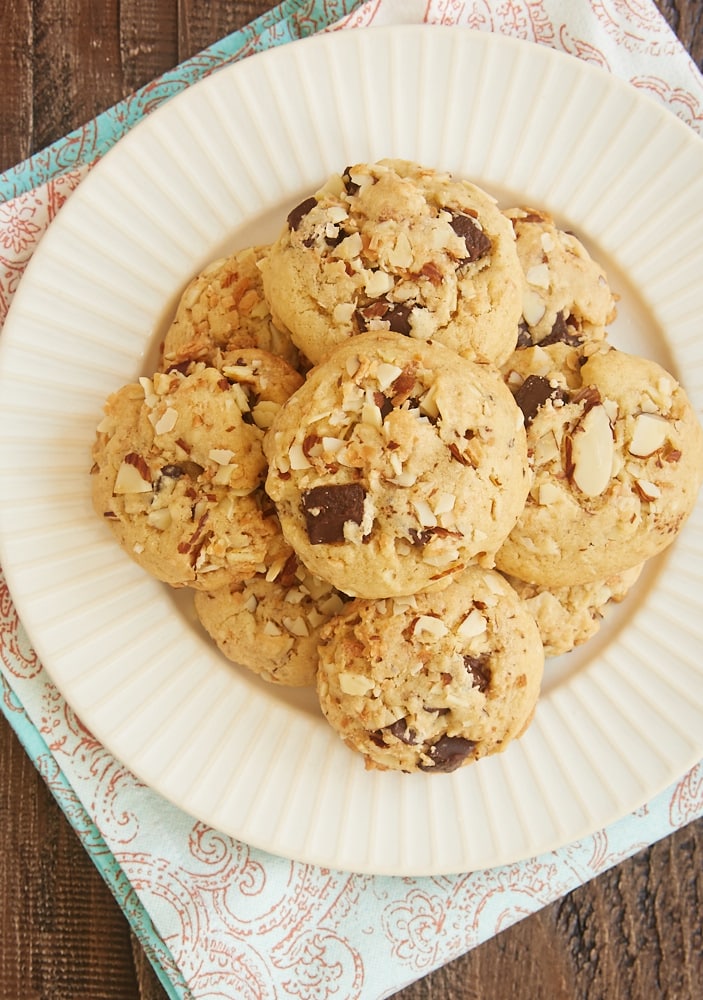 overhead view of Coconut Almond Chocolate Chip Cookies on a white and beige-rimmed plate