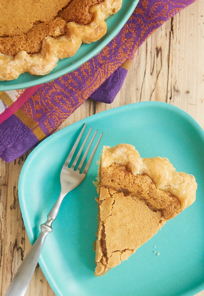 overhead view of a slice of Peanut Butter Chess Pie on a green plate