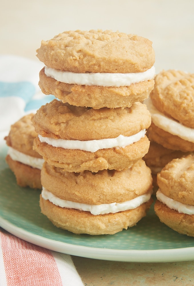 Peanut Butter Marshmallow Sandwich Cookies stacked on a green plate