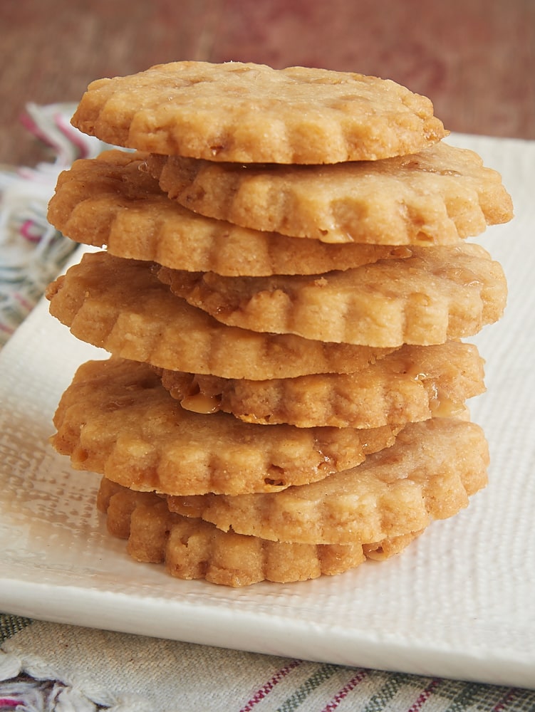 Stack of brown sugar toffee shortbread on a white plate.