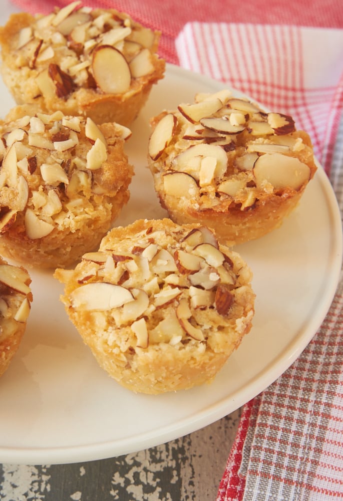 Raspberry Almond Tarts are simple bite-size tarts made with raspberry preserves and almond paste. Such a great flavor combination! - Bake or Break