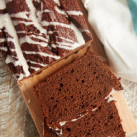 slices of Chocolate Pound Cake with Vanilla Bean Glaze on a cutting board