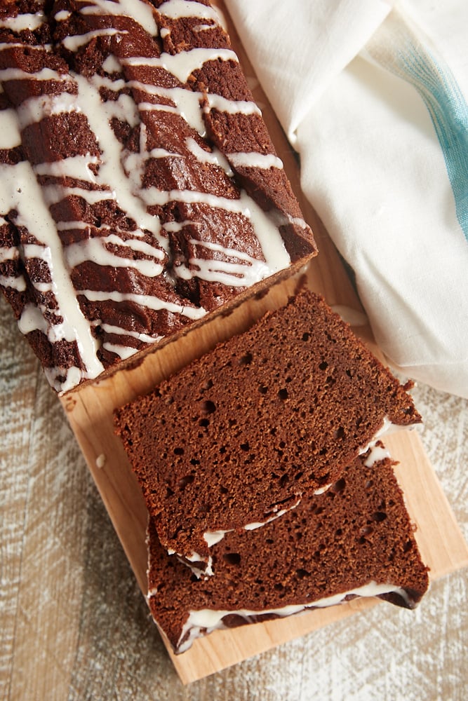 slices of Chocolate Pound Cake with Vanilla Bean Glaze on a cutting board