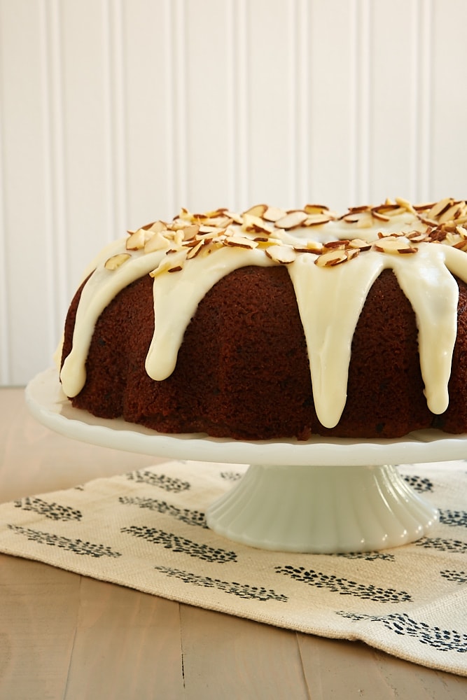 Blueberry Jam Cake topped with a cream cheese glaze and almonds - Bake or Break