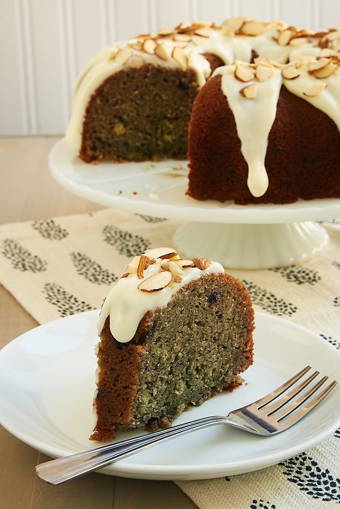 Blueberry Jam Cake topped with a cream cheese glaze and almonds - Bake or Break