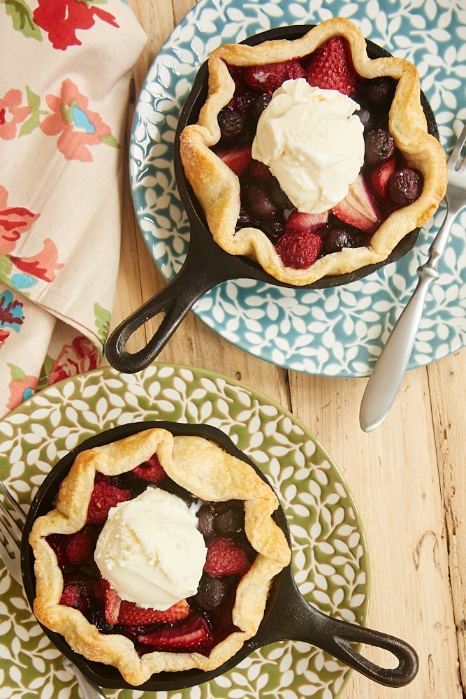 Mini Skillet Mixed Berry Pies topped with ice cream
