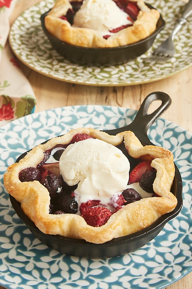 Mini Skillet Mixed Berry Pies topped with ice cream