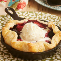 Mini Skillet Mixed Berry Pies topped with ice cream