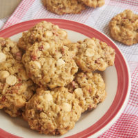 Strawberry White Chocolate Oatmeal Cookies on a red-rimmed plate