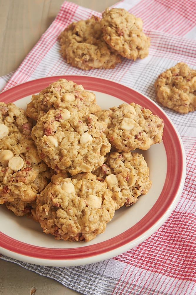 Strawberry White Chocolate Oatmeal Cookies on a red-rimmed plate