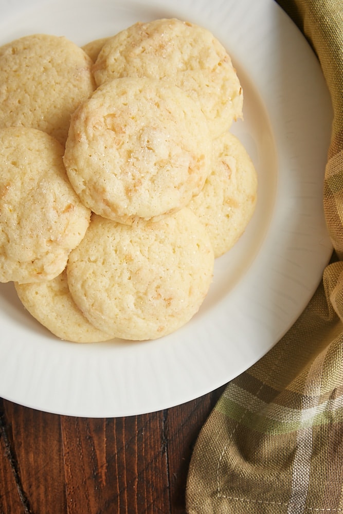 Lemon coconut sugar cookies piled on a plate.