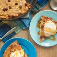 Brown Butter Skillet Blondie served with ice cream and caramel sauce