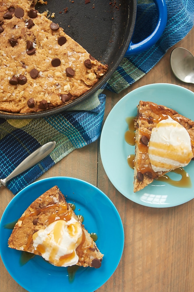 Brown Butter Skillet Blondie served with ice cream and caramel sauce