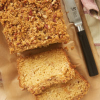 overhead shot of a partially sliced loaf of Ginger Pear Bread