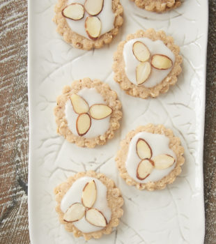 Almond Spice Cookies topped with a simple glaze and sliced almonds