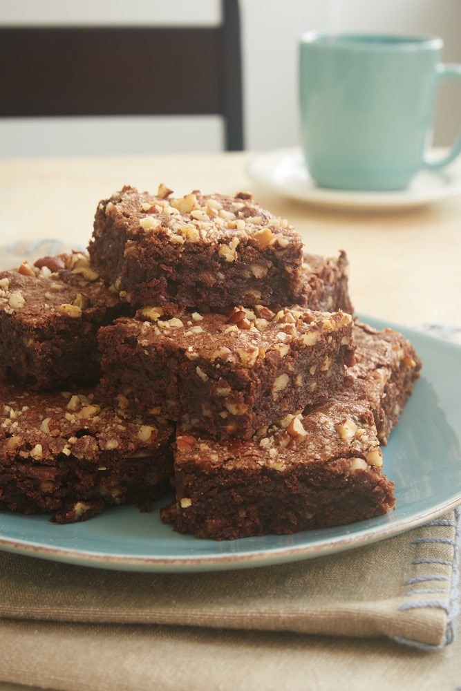 Double Chocolate Cinnamon Pecan Brownies served on a blue plate