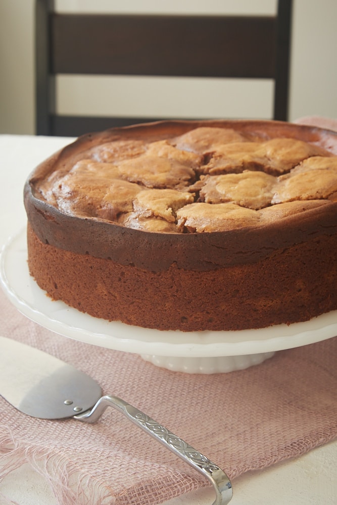 Cinnamon Roll Cream Cheese Coffee Cake on a white cake stand