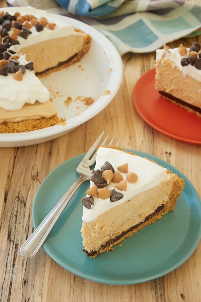 slice of Black Bottom Peanut Butter Pie served on a green plate