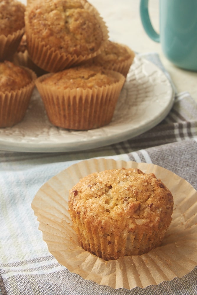 an unwrapped Brown Butter Coconut Pecan Muffin