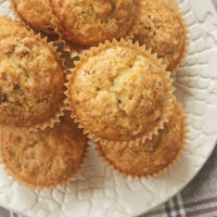 Brown Butter Coconut Pecan Muffins on a white plate