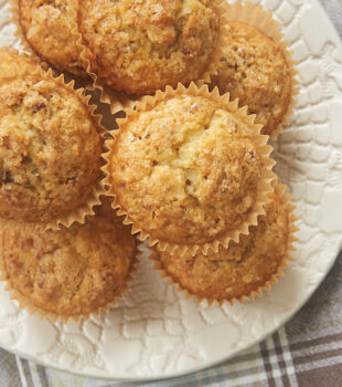 Brown Butter Coconut Pecan Muffins on a white plate