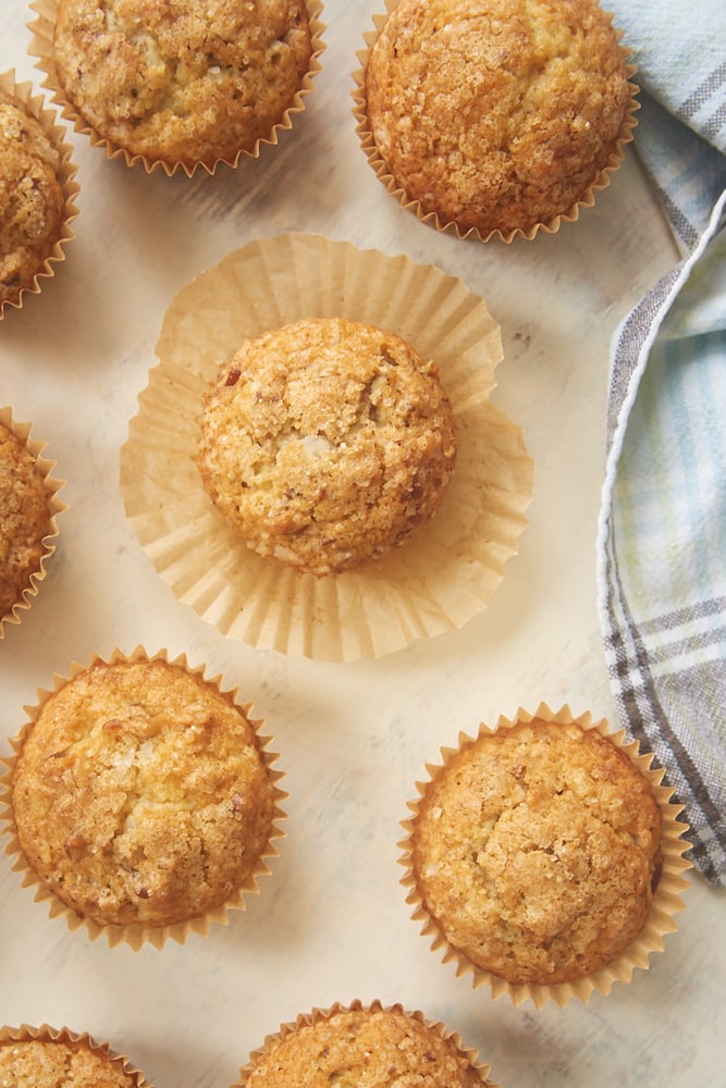 Brown Butter Coconut Pecan Muffins on a light surface
