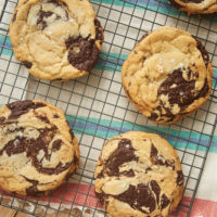 Jacques Torres Chocolate Chip Cookies on a wire cooling rack