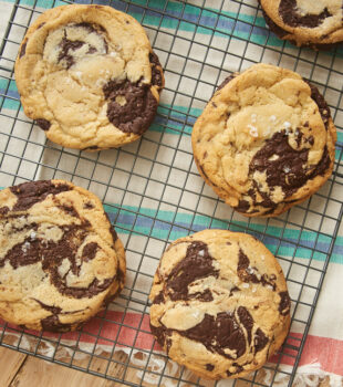 Jacques Torres Chocolate Chip Cookies on a wire cooling rack