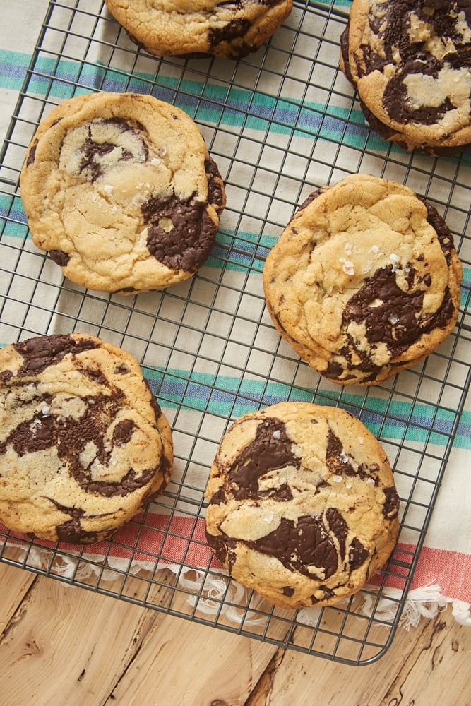 Jacques Torres Chocolate Chip Cookies on a wire cooling rack