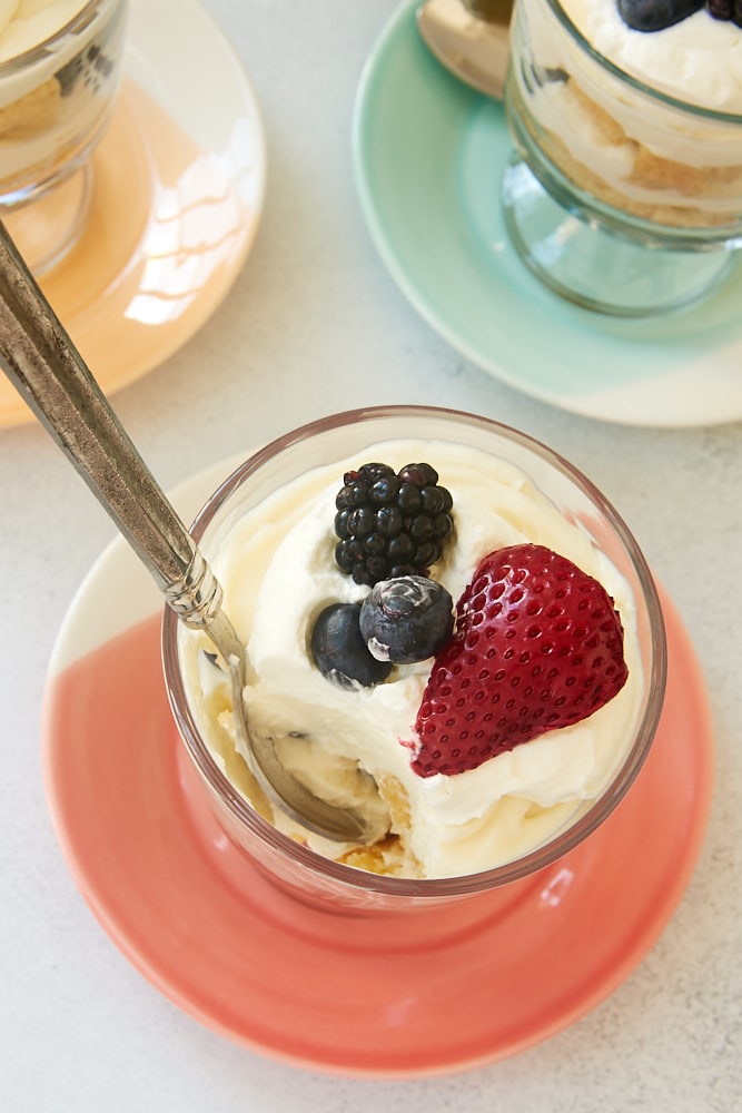 Individual Berry Cheesecake Trifle topped with blueberries, blackberries, and strawberries