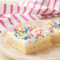 Frosted Sugar Cookie Bars topped with sprinkles