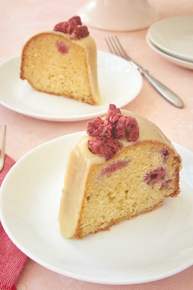 slices of White Chocolate Raspberry Bundt Cake served on white plates