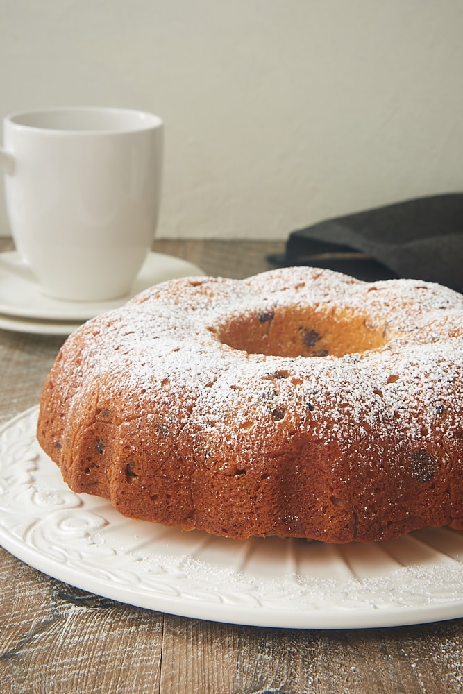 Chocolate Chip Muffin Cake on a white cake plate