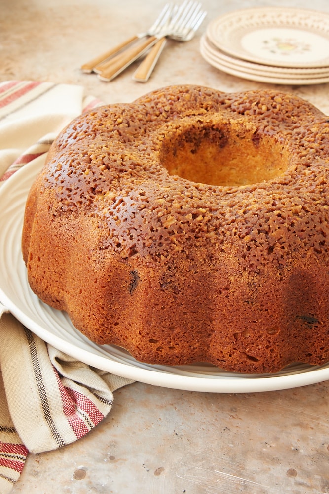 Chocolate Chunk Pecan Crunch Bundt Cake on a white plate