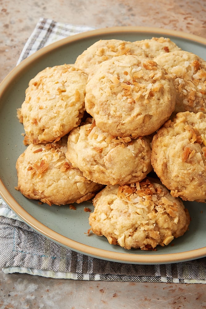 Coconut Cashew Toffee Cookies piled on a light green plate