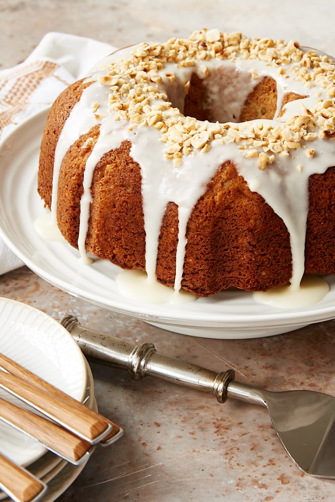 Hazelnut Pear Bundt Cake on a white cake stand