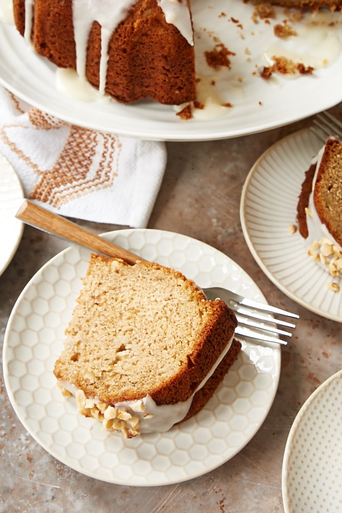 slice of Hazelnut Pear Bundt Cake topped with a sour cream glaze