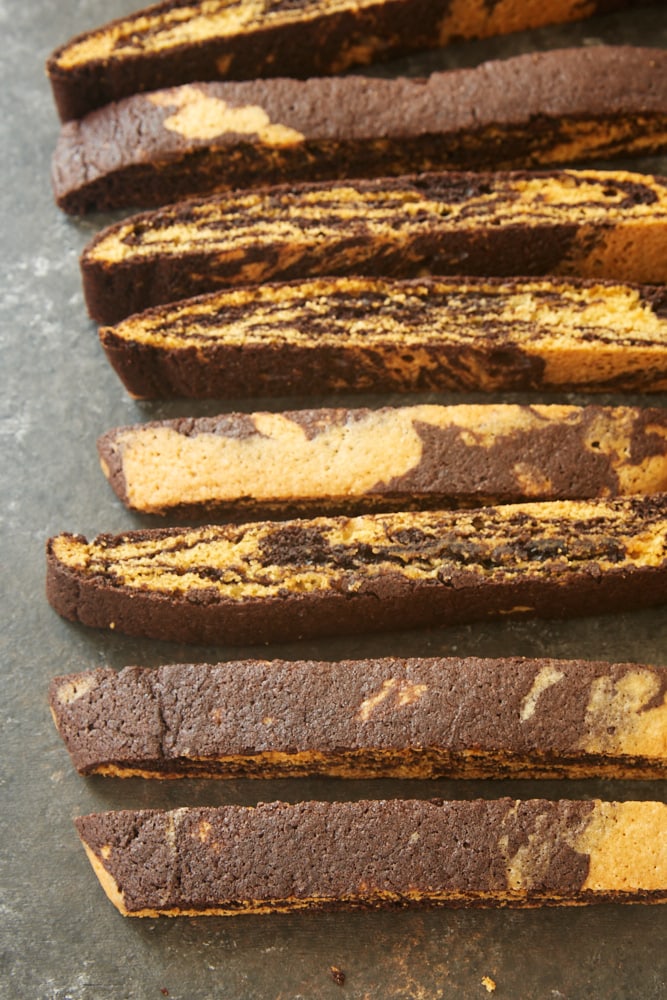 Chocolate Vanilla Marbled Biscotti on a dark surface